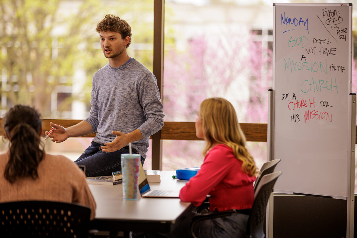 Student presenting to fellow students