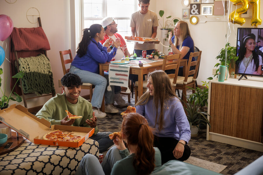 Group of students celebrating in apartment