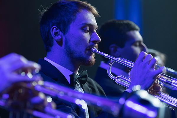 Student playing the trumpet at a concert