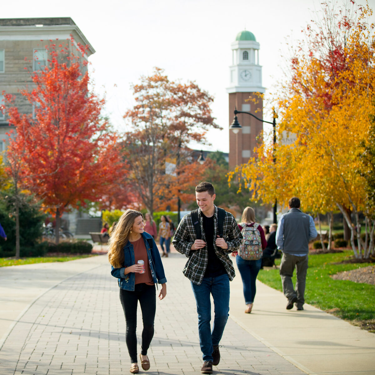 Two students on a walk through campus