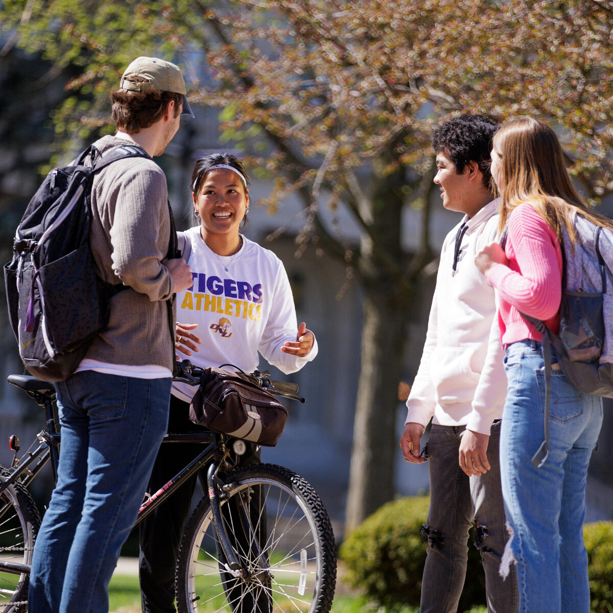 Students on main campus esplanade talking, laughing.