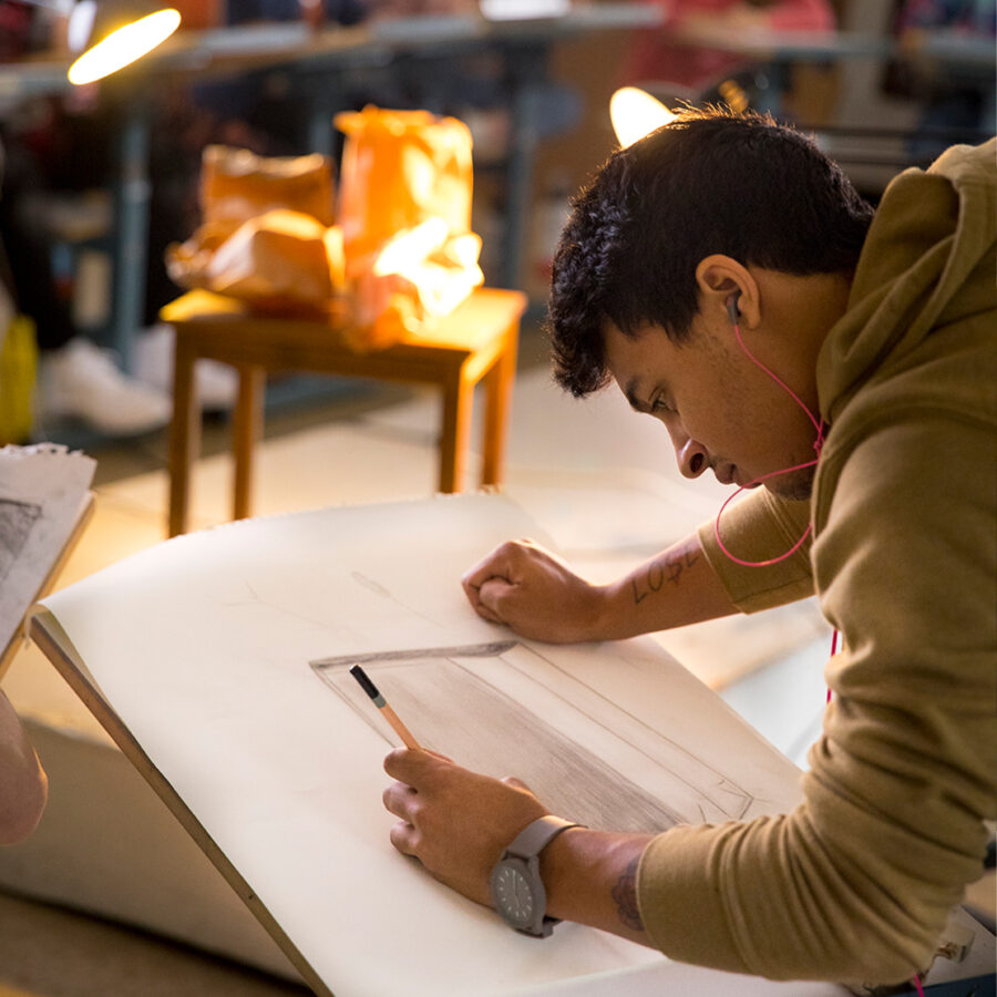 Student participates in drawing class in SIMS Center