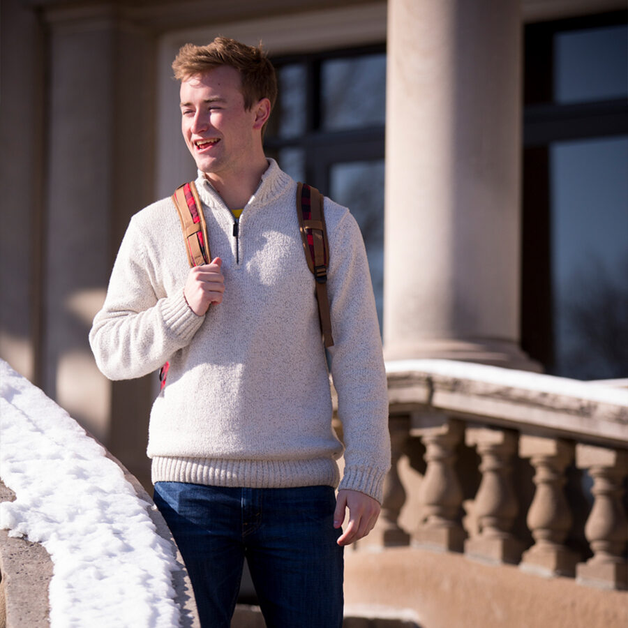 Male student posing in front of Burke