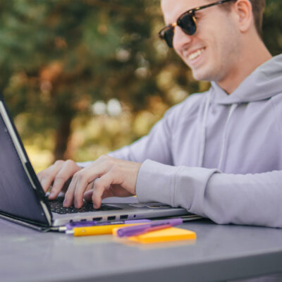 man on laptop outside