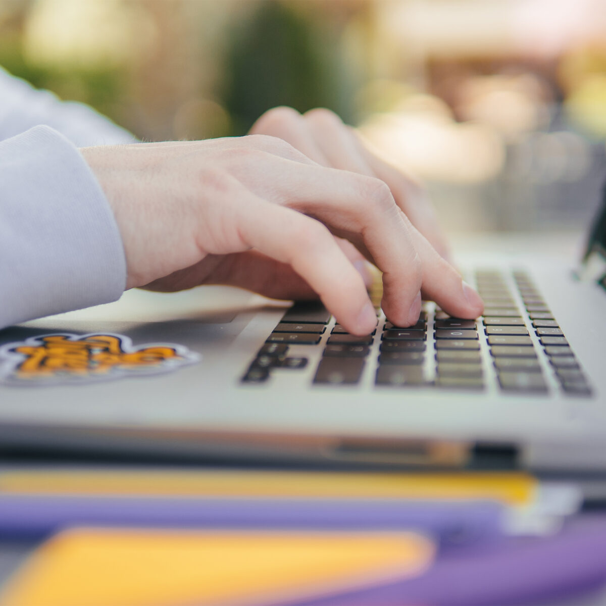 Close up shot of student working on laptop