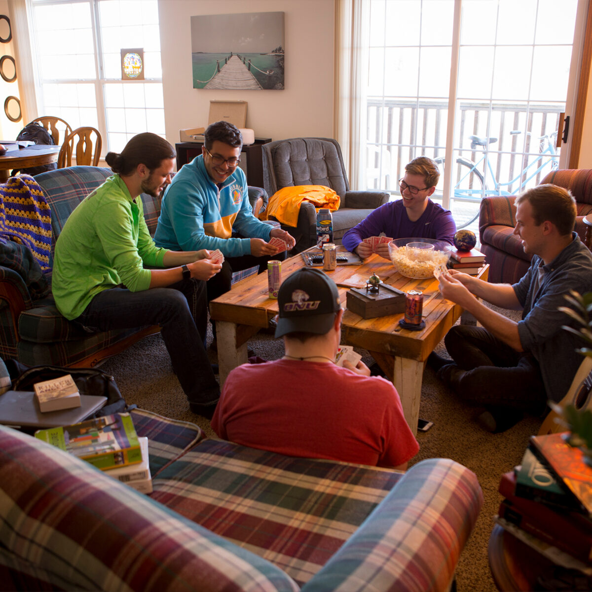 Students playing a game in their apartment