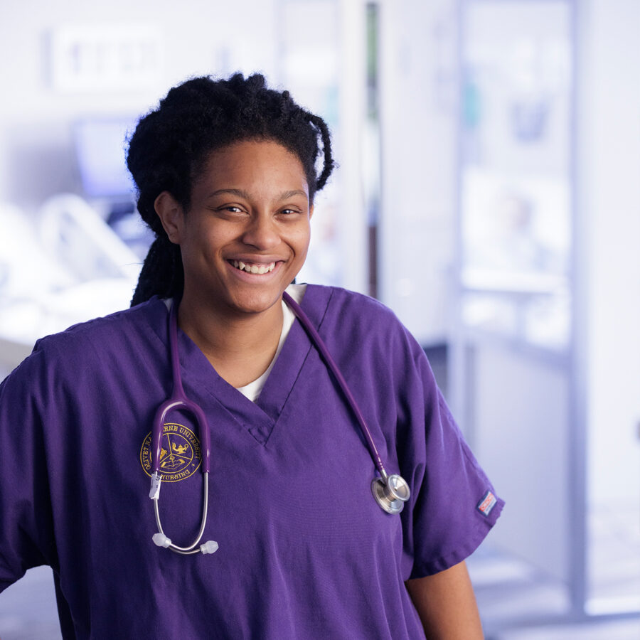 female nurse smiling at camera