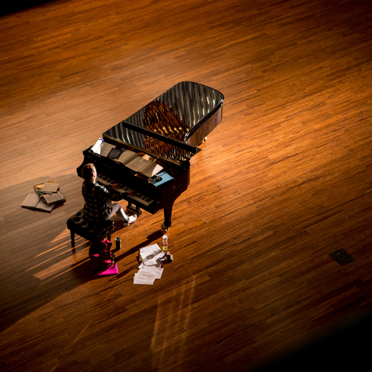 Student plays piano on Centennial Chapel stage