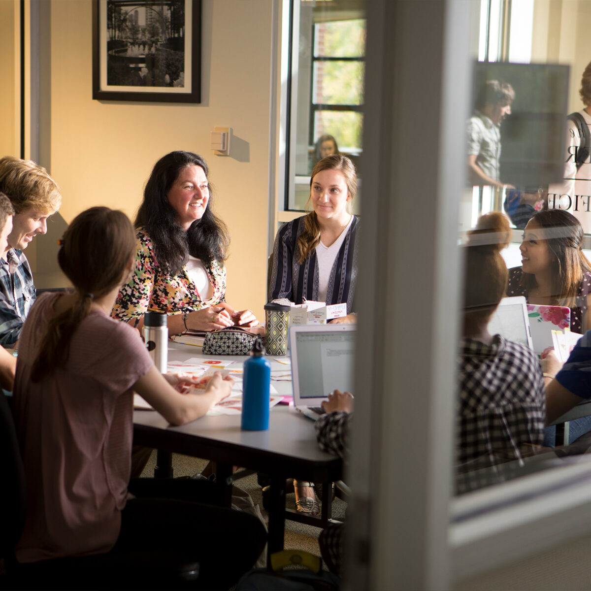 Group of students discussing in an office