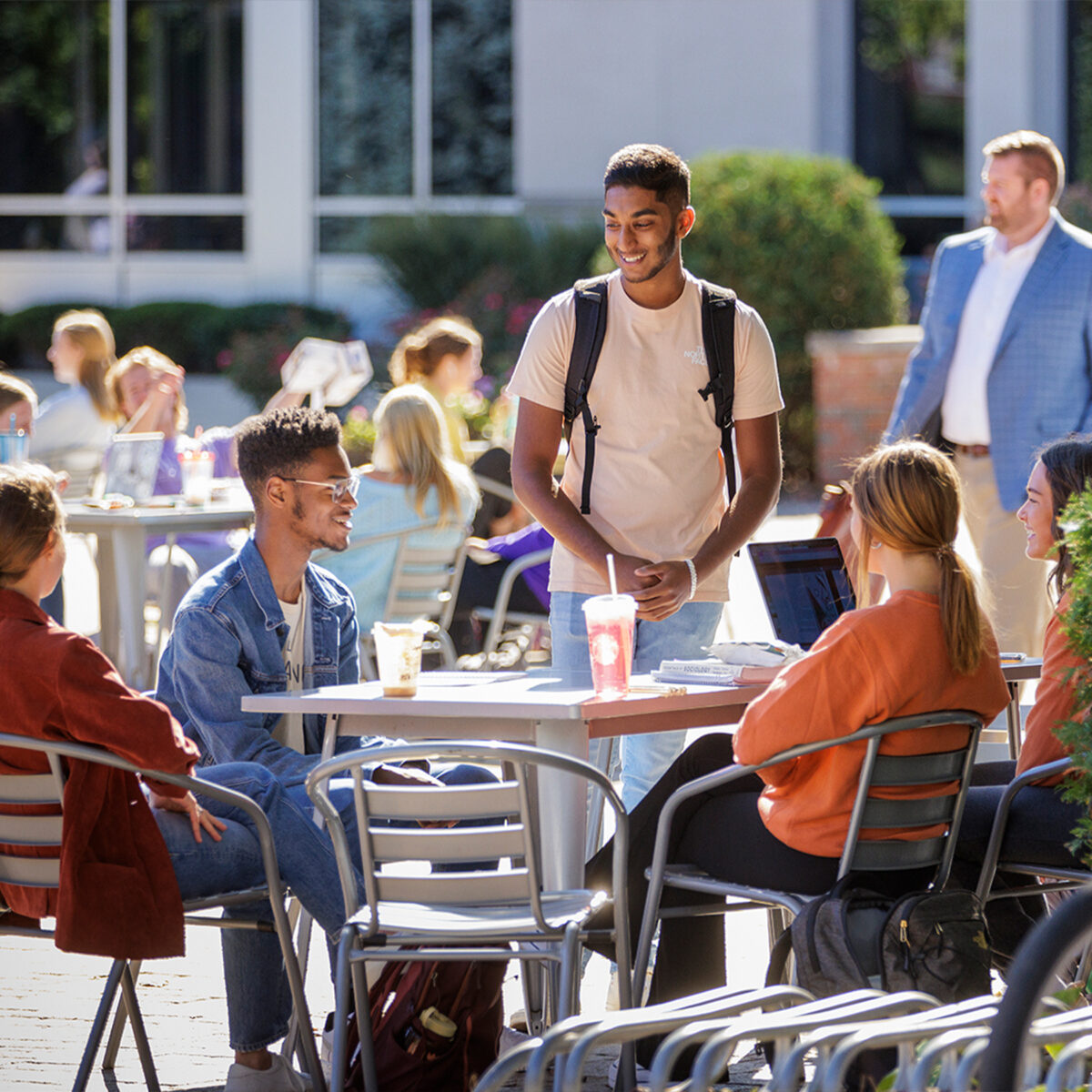 Group of smiling students in the Quad