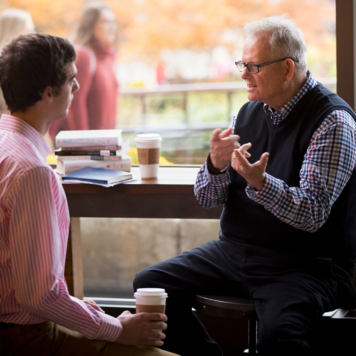 Professor engages in conversation with a student