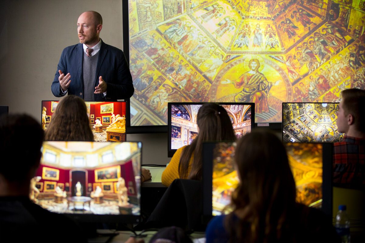 Prof Seals instructing students about art history