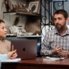 biology professor in office with 2 students