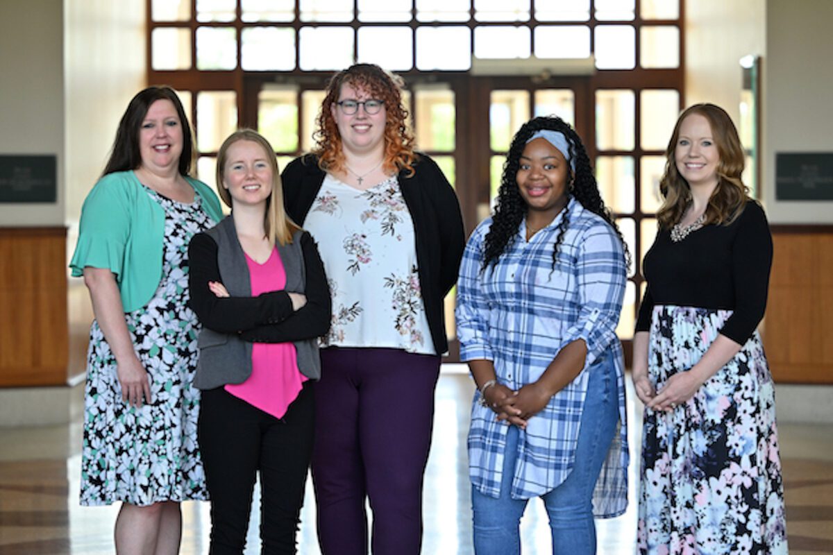 graduate admissions team standing in Weber lobby