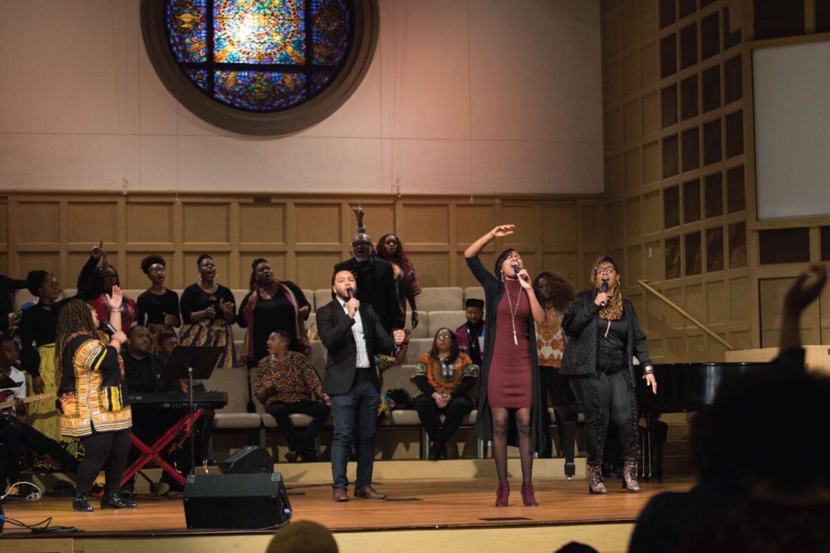 man and woman singing on stage