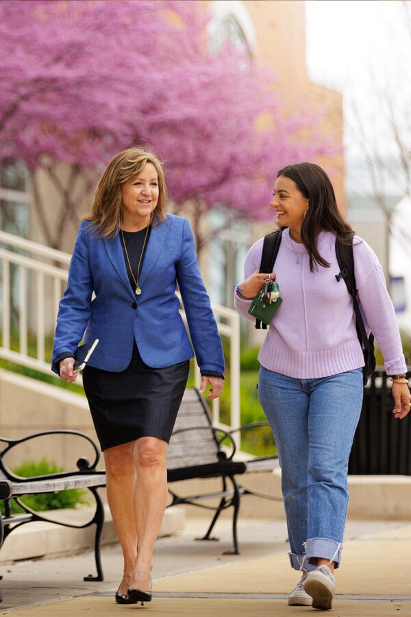 Dr. Lynda Allen engages in conversation with a student