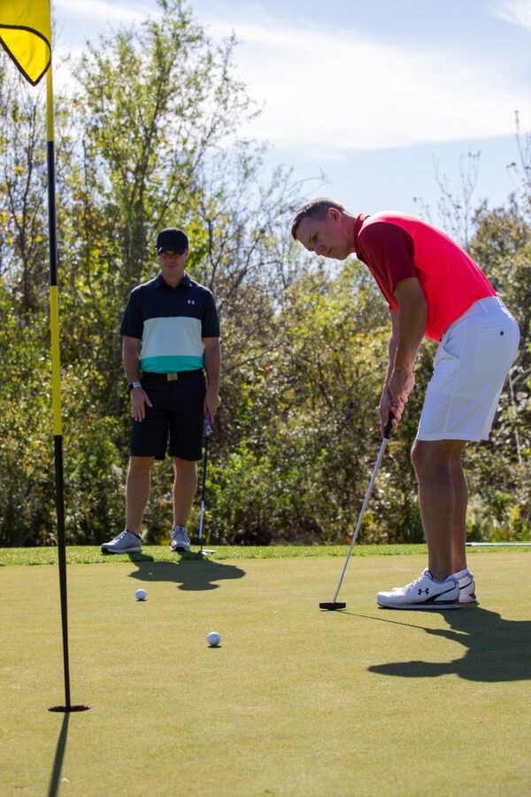 Man putting at the winter golf outing