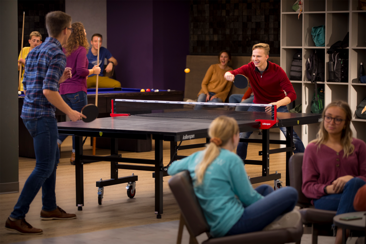 Students playing ping pong in lower Ludwig Center