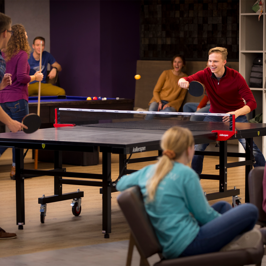 Students playing ping pong in lower Ludwig Center
