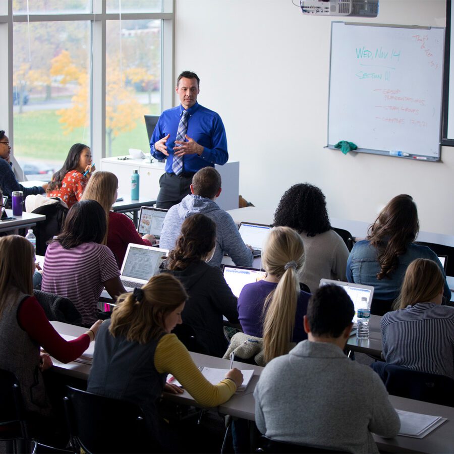 Psychology professor teaching to a group of students