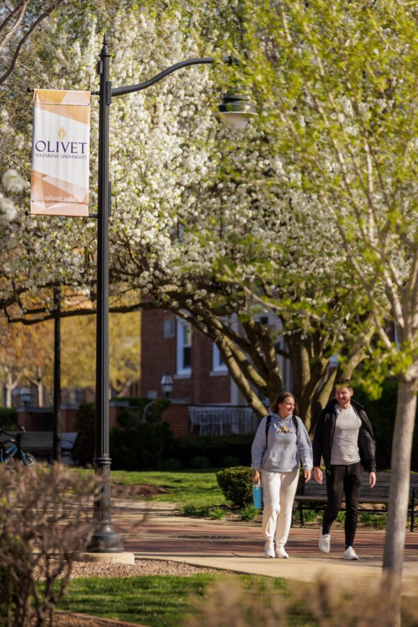 Two students walking through campus