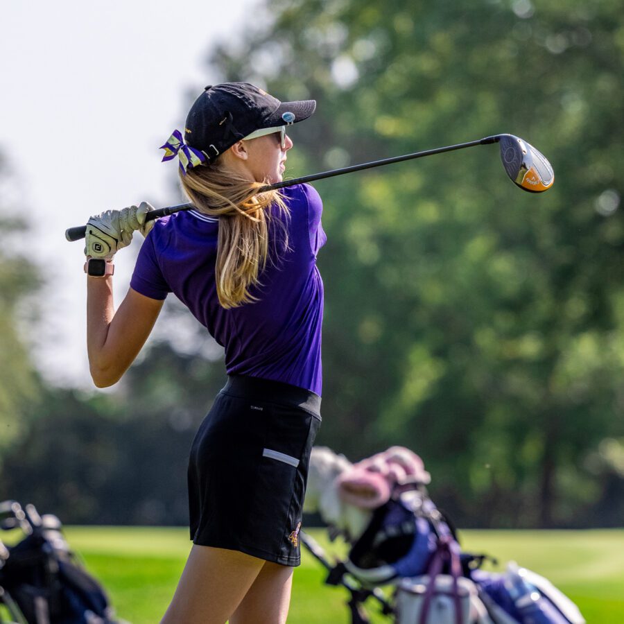 Women's golf player in action