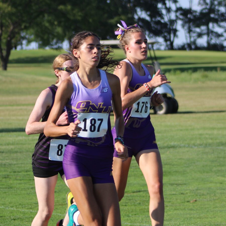 Women's cross country athletes in action