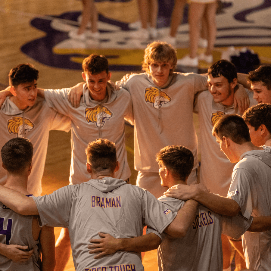 men's basketball group huddle