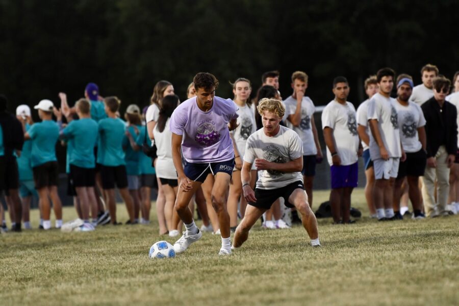 males playing soccer