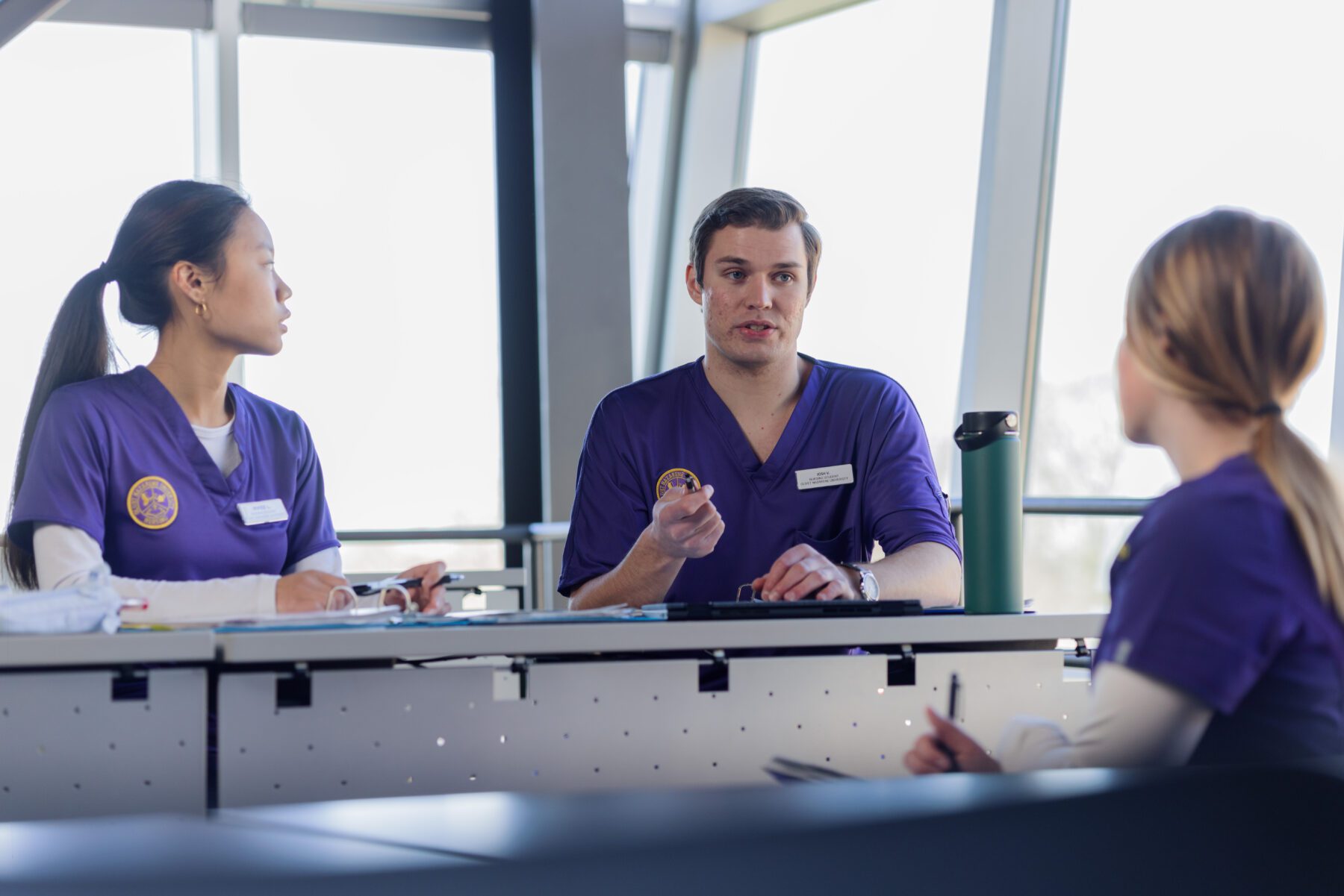 nursing students talking in classroom