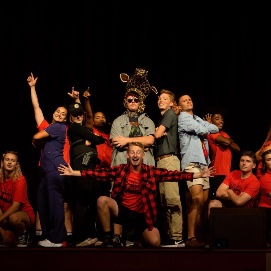 students posing on stage during variety show