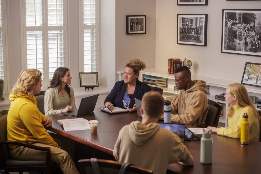 Amber Residori meeting with students in conference room