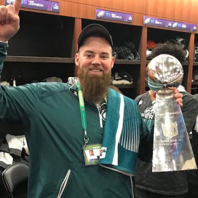Micah Gerhart holding the Super Bowl trophy