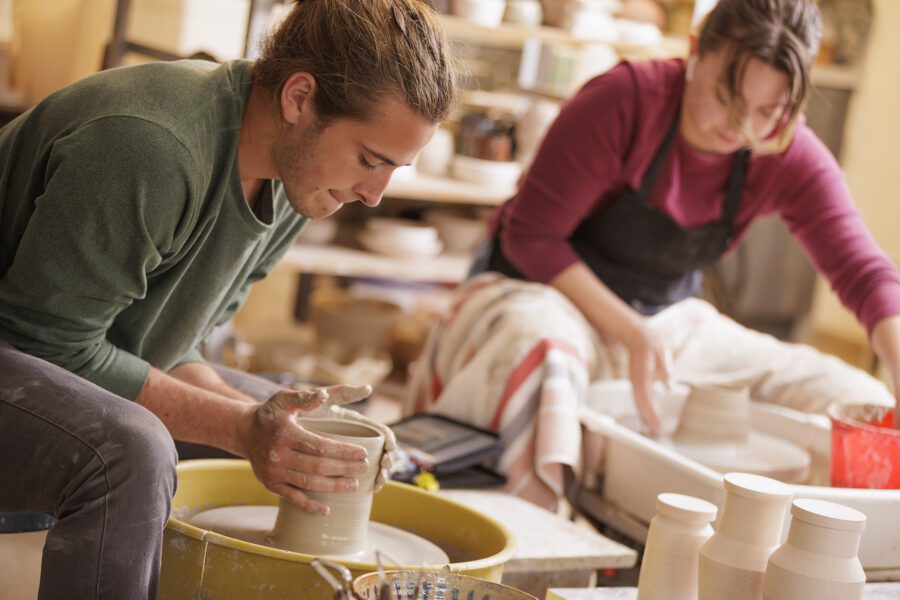 man doing pottery