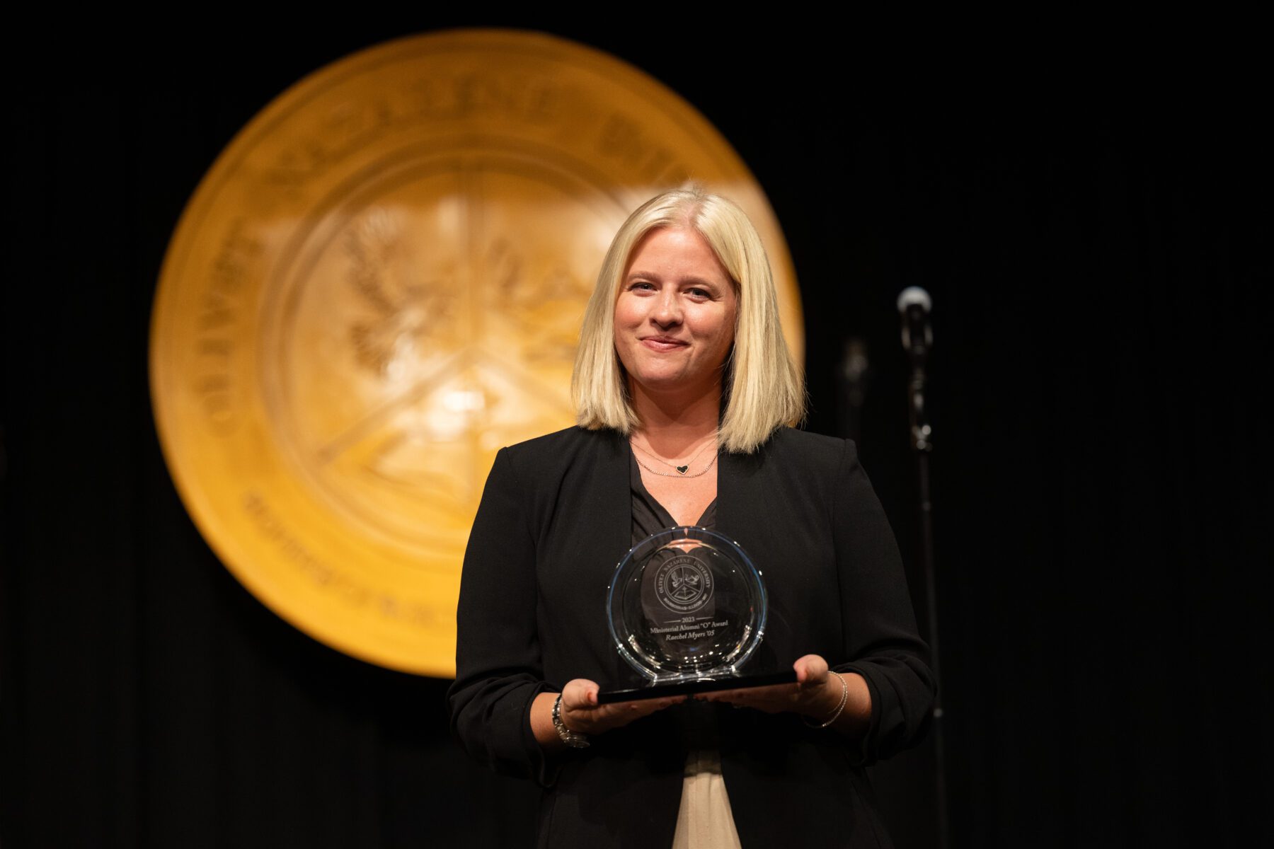 Rachel Meyers accept the "O" Award for Ministerial Alumni.