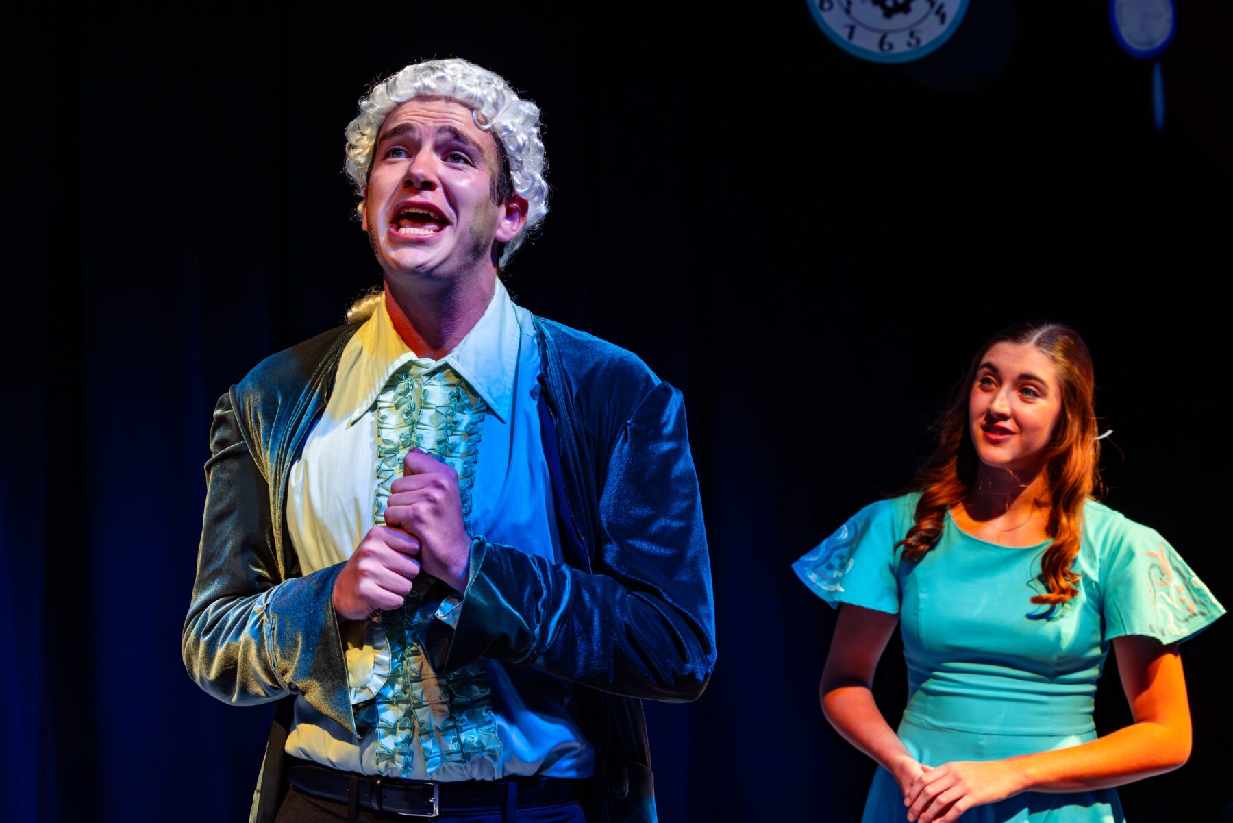 In the Olivet Production of Alice in Wonderland Alice watches Amish Sing.