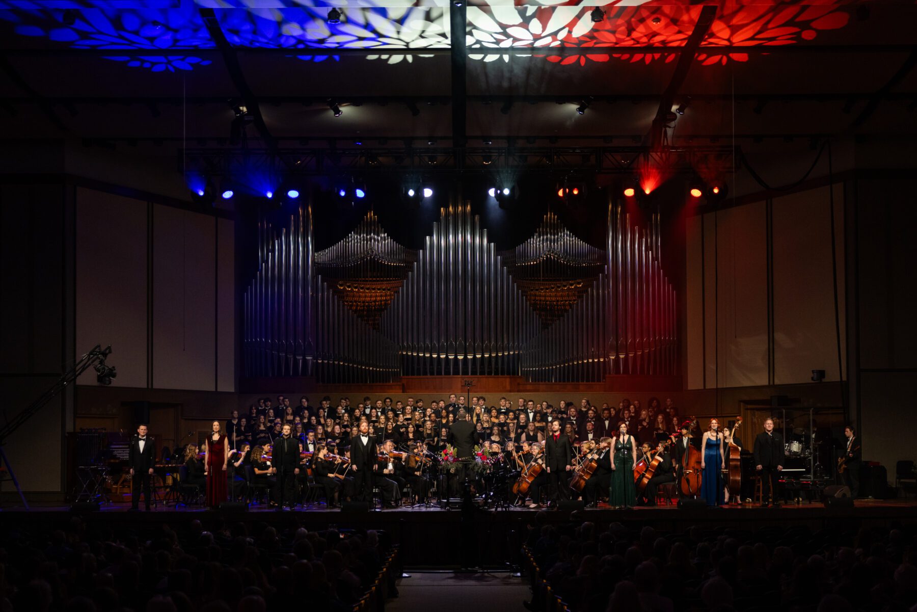 All soloists and orchestra perform on the stage in Centennial Chapel.
