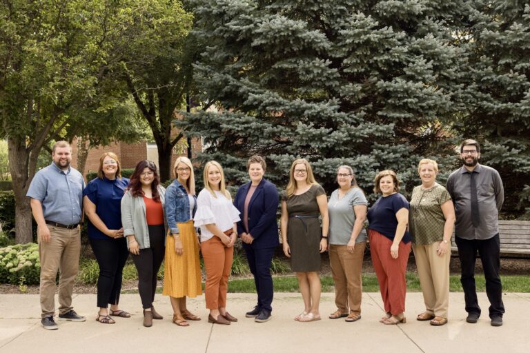 Center for Academic Excellence staff standing outside 