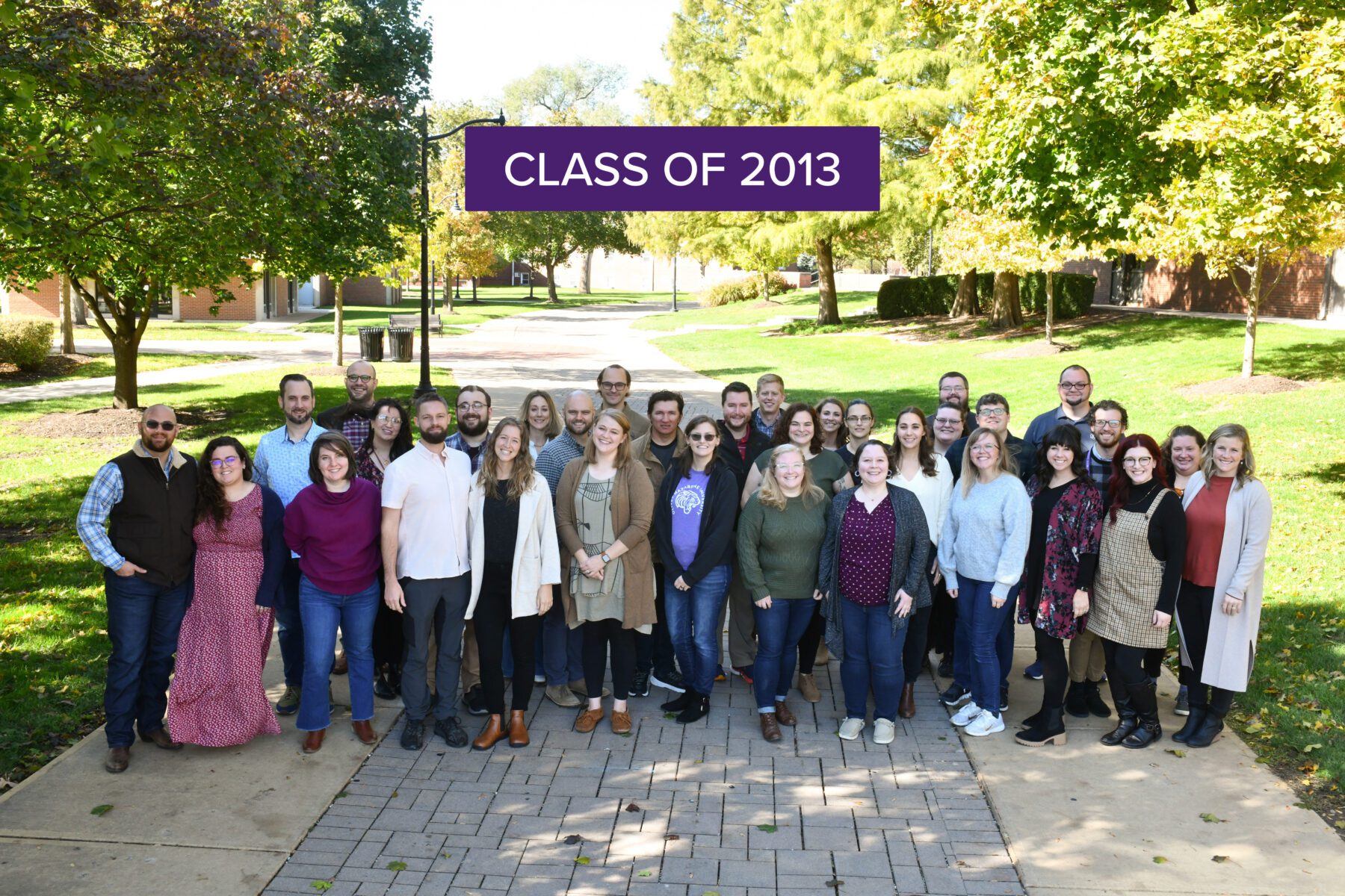Those who came for the class reunion of 2013 pose for a group photo