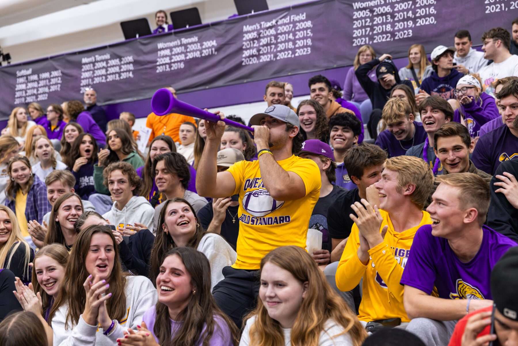 Fans at the Basketball game cheer in support for Olivet.