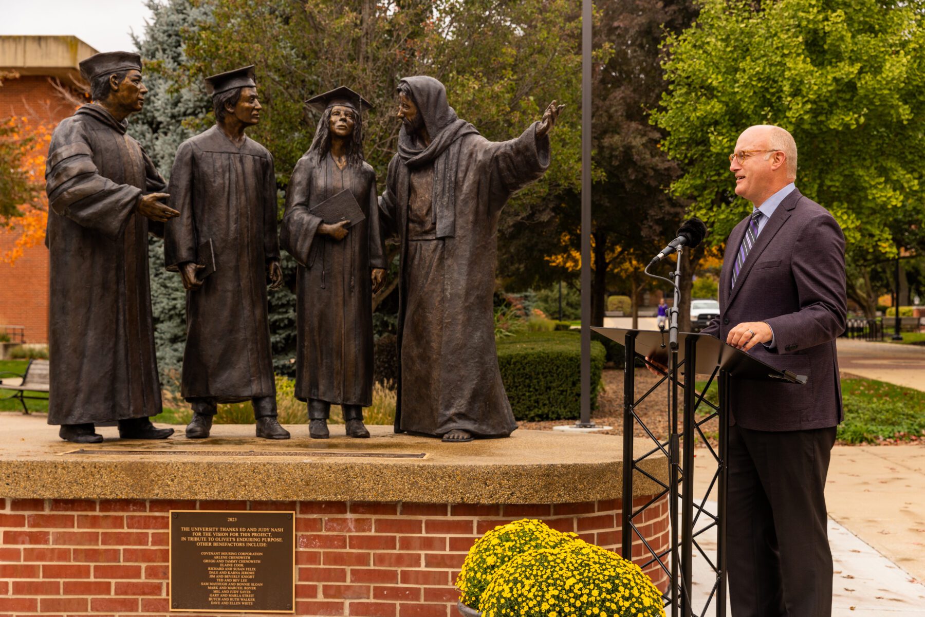 President Gregg Chenoweth speaks to those who came to the unveiling of the new statue on campus.