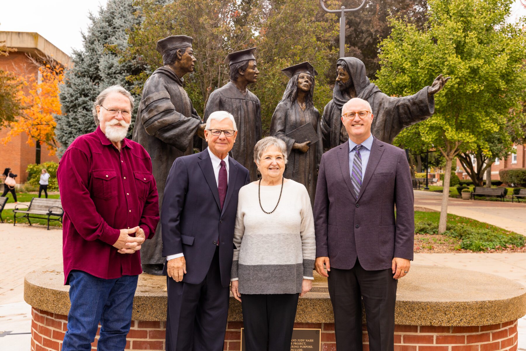 A group photo of President Gregg Chenoweth, Scott Stearman, and Mr. and Mrs. Nash