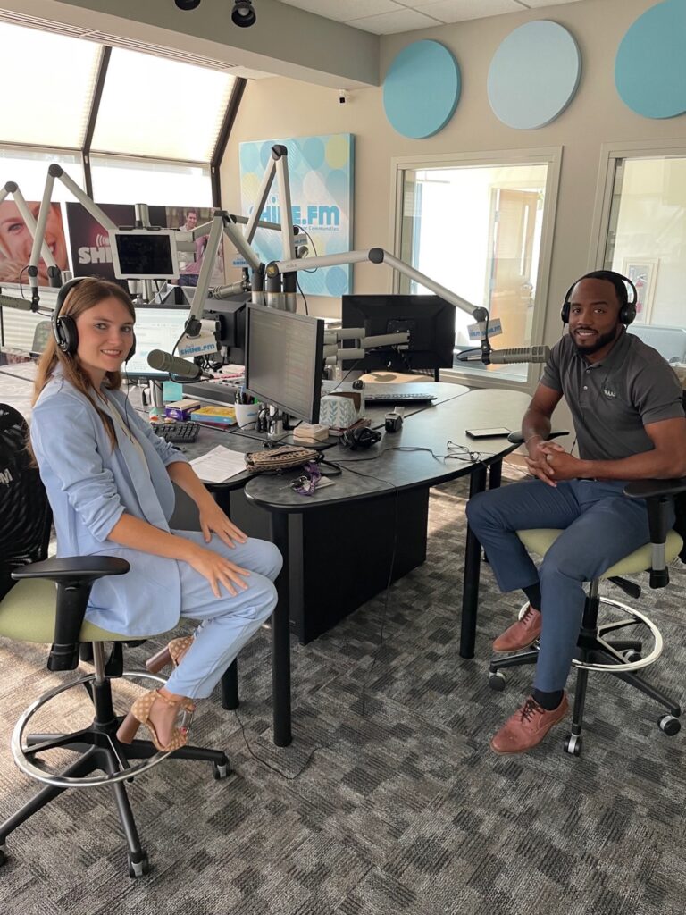 man and woman recording podcast