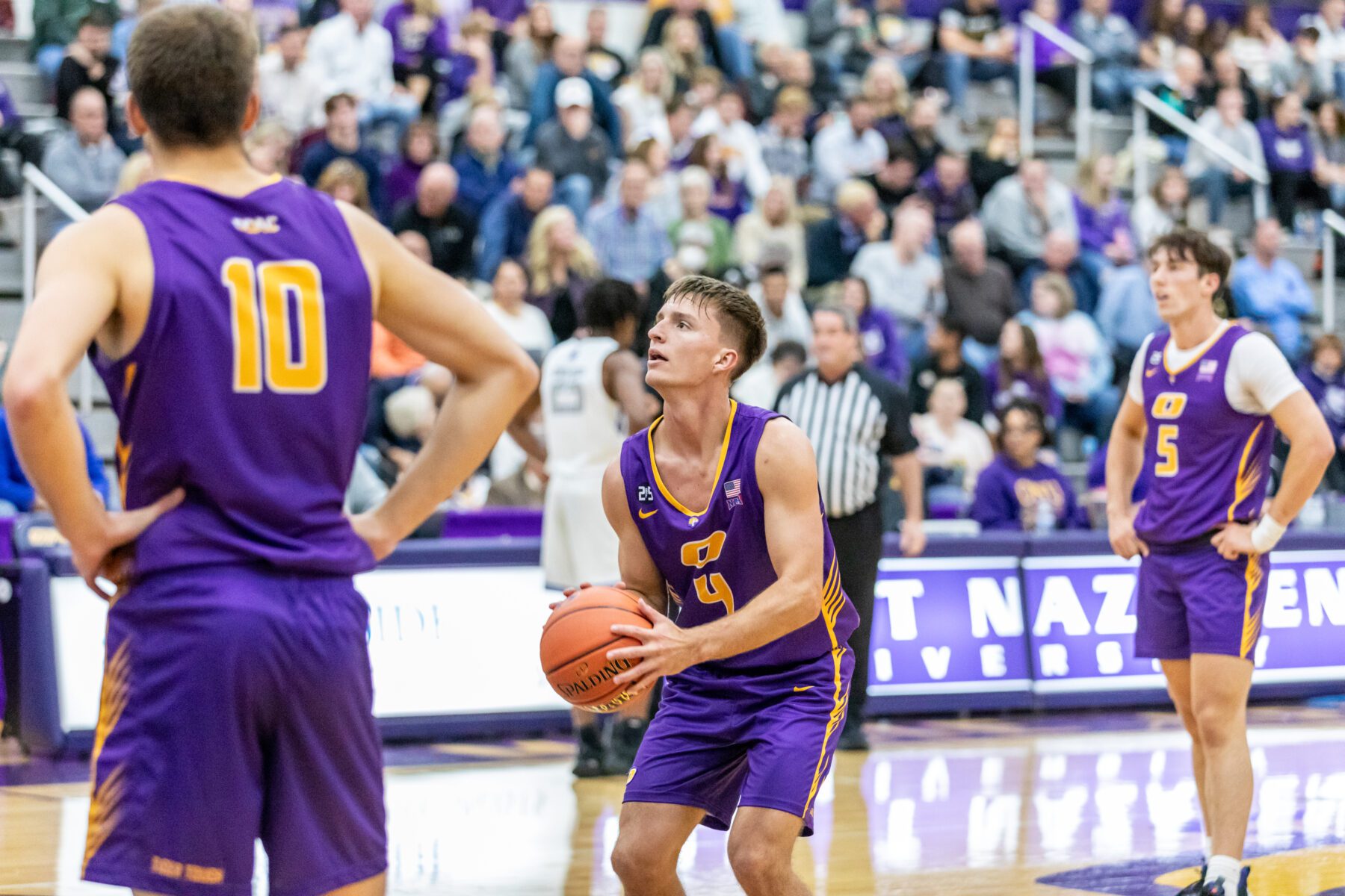 Olivet men's basketball player steps up to the free throw line.