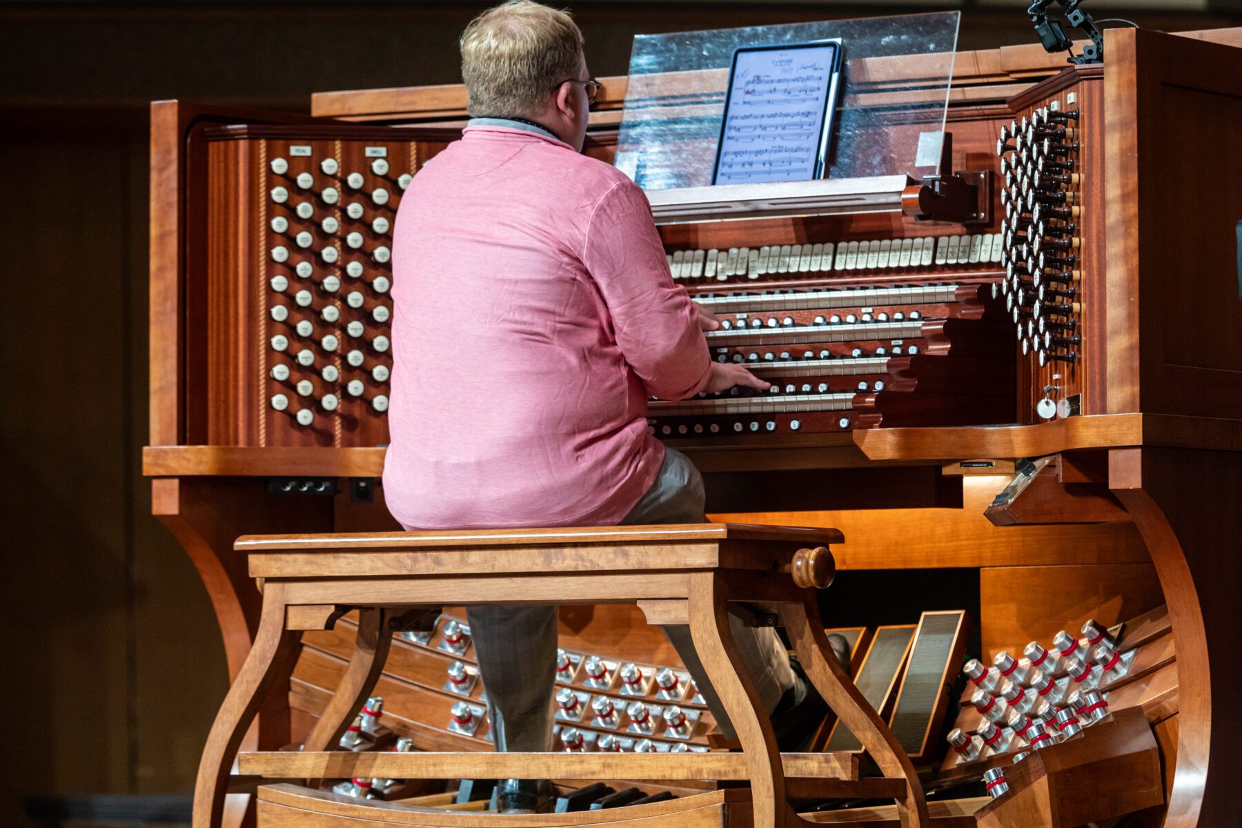 A close up shot of the organ player.