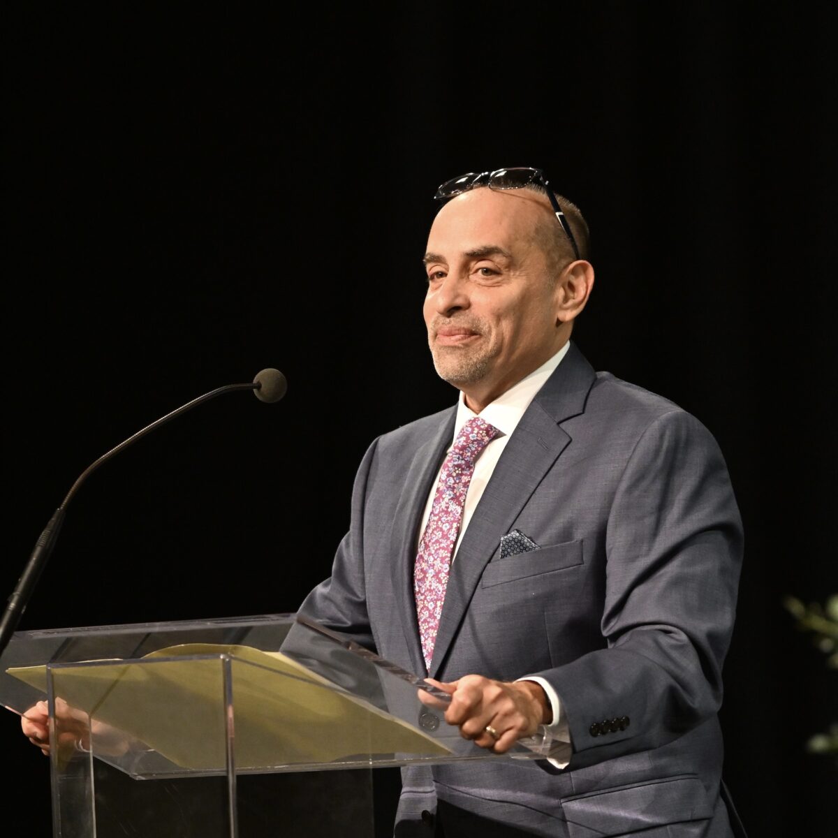 Angel Colón speaking at podium