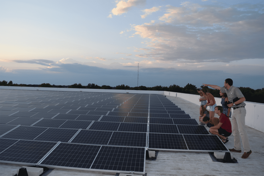 Group of students gather to engineer solar panels