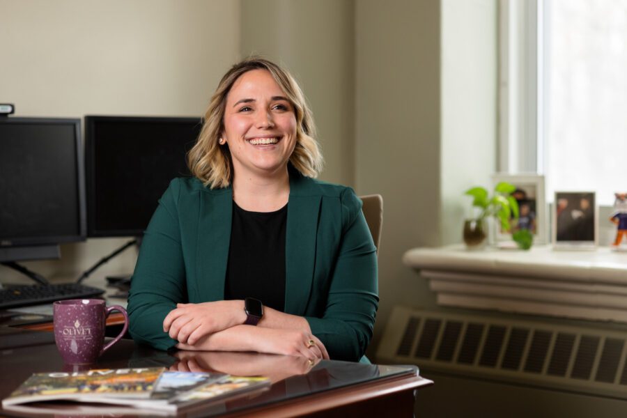 Erika Moeschke sitting at desk smiling