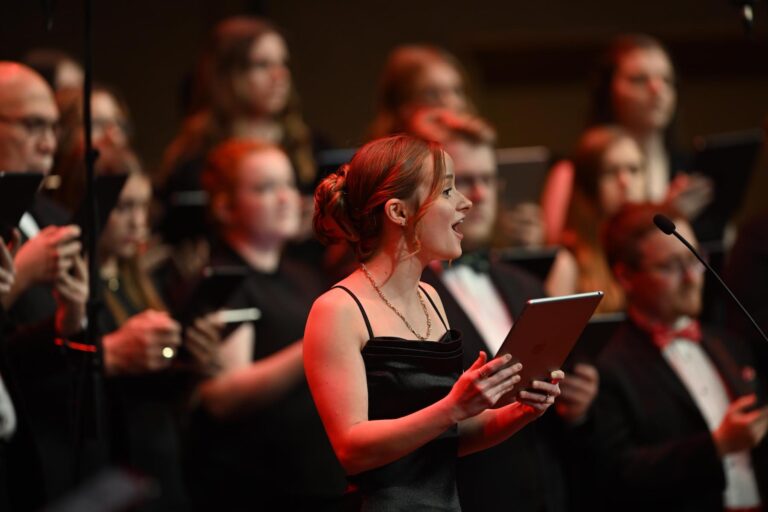 Female student singing on stage