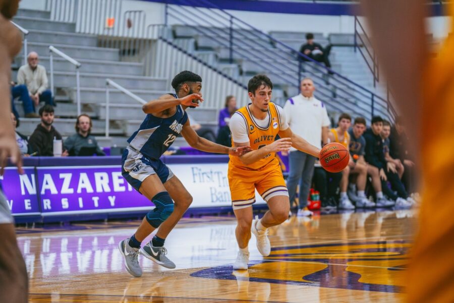 two males playing basketball